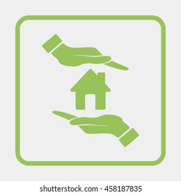 Hand holding house.