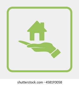 Hand holding house.