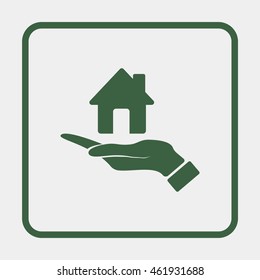 Hand holding house.
