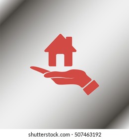 Hand holding house.