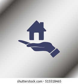 Hand holding house.