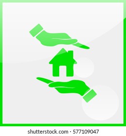 Hand holding house.