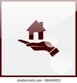 Hand holding house.