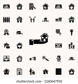 The hand is holding the house icon. Real estate icons universal set for web and mobile