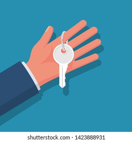 Hand holding house keys. Handing key to home. Vector graphic illustration flat design. Template for sale, rent home. Isolated on white background. Real estate agent. Property gift.