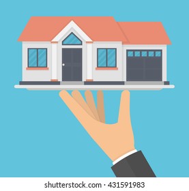 Hand holding a house model on a platter. Flat design