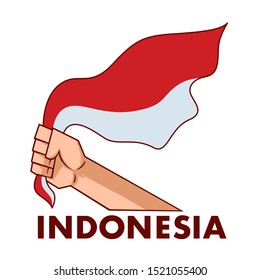 A hand holding the Indonesian flag
