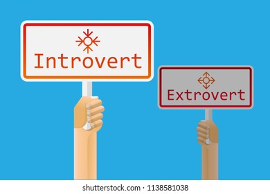 Hand holding introvert and extrovert sign.