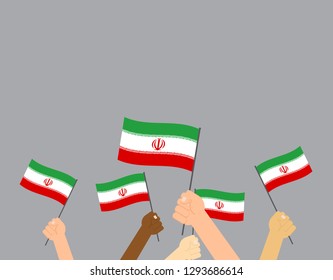 Hand holding Iran flags isolated on gray background
