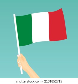 hand holding italian flag - vector illustration