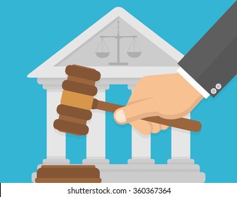 Hand holding judge gavel in front of a courthouse with balance symbol. Flat design