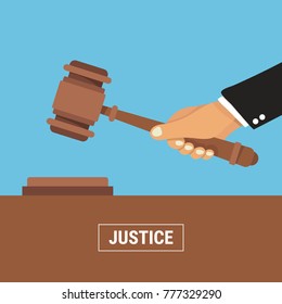 Hand holding judges gavel. vector illustration in flat design on blue background. justice concept.