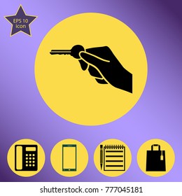 Hand holding key to unlock a door. black vector icon on flat designe style