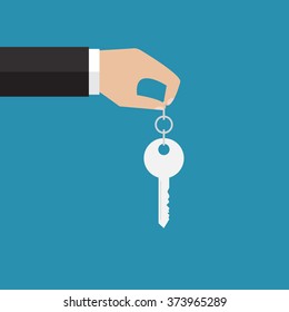 The hand holding a key. Vector illustration. Flat design