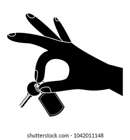hand holding keychain and key