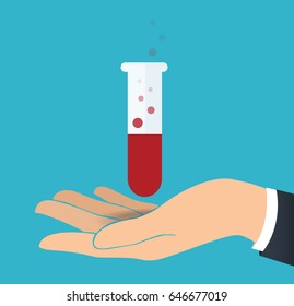 hand holding laboratory filled with a clear liquid and blue background