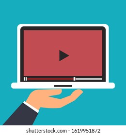 Hand holding laptop. Vector illustration.
