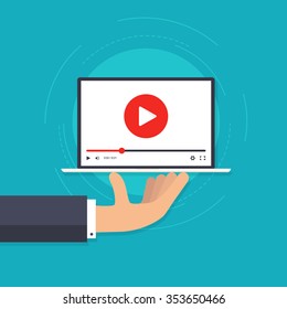 Hand holding laptop with video player. Webinar advertising icon. Video playback on laptop. Social media presentation. Online learning tutorial player. Content presentation. Vector illustration