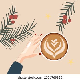 A hand holding a latte cup with a beautiful foam heart pattern. Twigs with red berries and yellow stars are visible in the background, which creates a feeling of warmth and festive mood. Christmas
