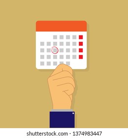 Hand holding a leaf of a calendar with the marked date flat design