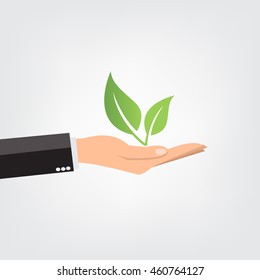 Hand holding leaves - vector illustration