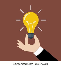 Hand holding light bulb. Business idea concept.