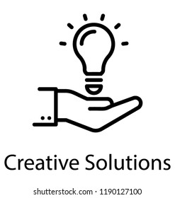 Hand holding light bulb showing icon for creative solution icon