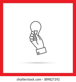 Hand holding lightbulb