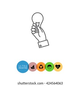 Hand holding lightbulb