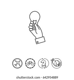 Hand holding lightbulb