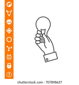 Hand holding lightbulb