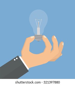 Hand holding a lightbulb. Flat style