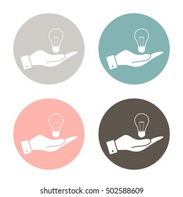 hand holding a lightbulb sign. character ideas. incandescent lamp . icon of electric light