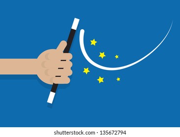 Hand holding magic wand generating stars