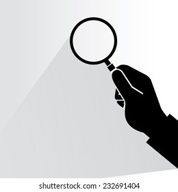 hand holding magnifier glass on white background, flat and shadow theme