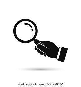 Hand holding magnifying glass icon. Black silhouette isolated on white background. Vector flat illustration. Search concept.