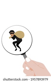 The hand is holding a magnifying glass that is looking at the thief