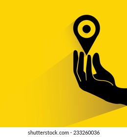 hand holding map pointer, map navigator on yellow background, flat and shadow theme