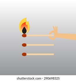 Hand holding match.