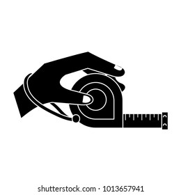 Hand holding measure tape