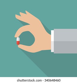 Hand Holding Medical Pill. Vector Illustration