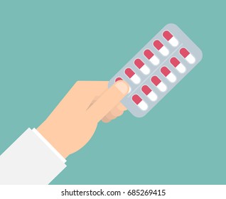 Hand holding medical pills in blister pack. Vector illustration in flat style