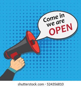 Hand holding megaphone with bubble speech come in we are open