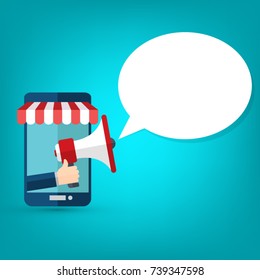 Hand holding megaphone with bubble speech - mobile phone advertising concept