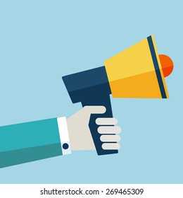 Hand holding a megaphone. Flat design. Promotion and advertising concept