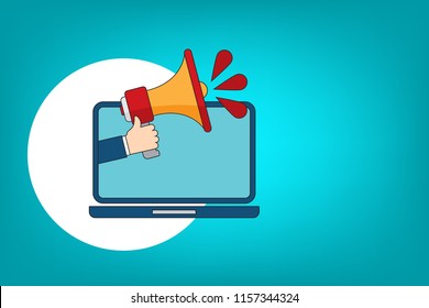 Hand holding megaphone with laptop icon - online  marketing, advertising concept