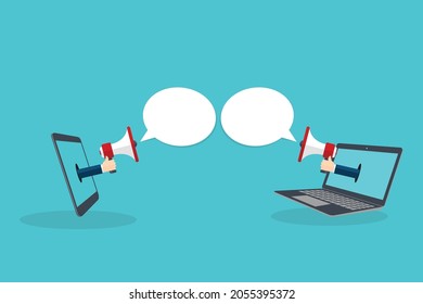 Hand holding megaphone. Smart phone and Laptop notebook computer screen background.