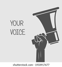 Hand holding megaphone - voice and opinion concept