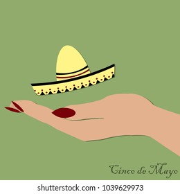 hand holding a Mexican hat