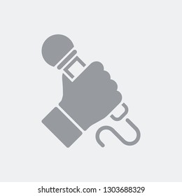 Hand holding microphone